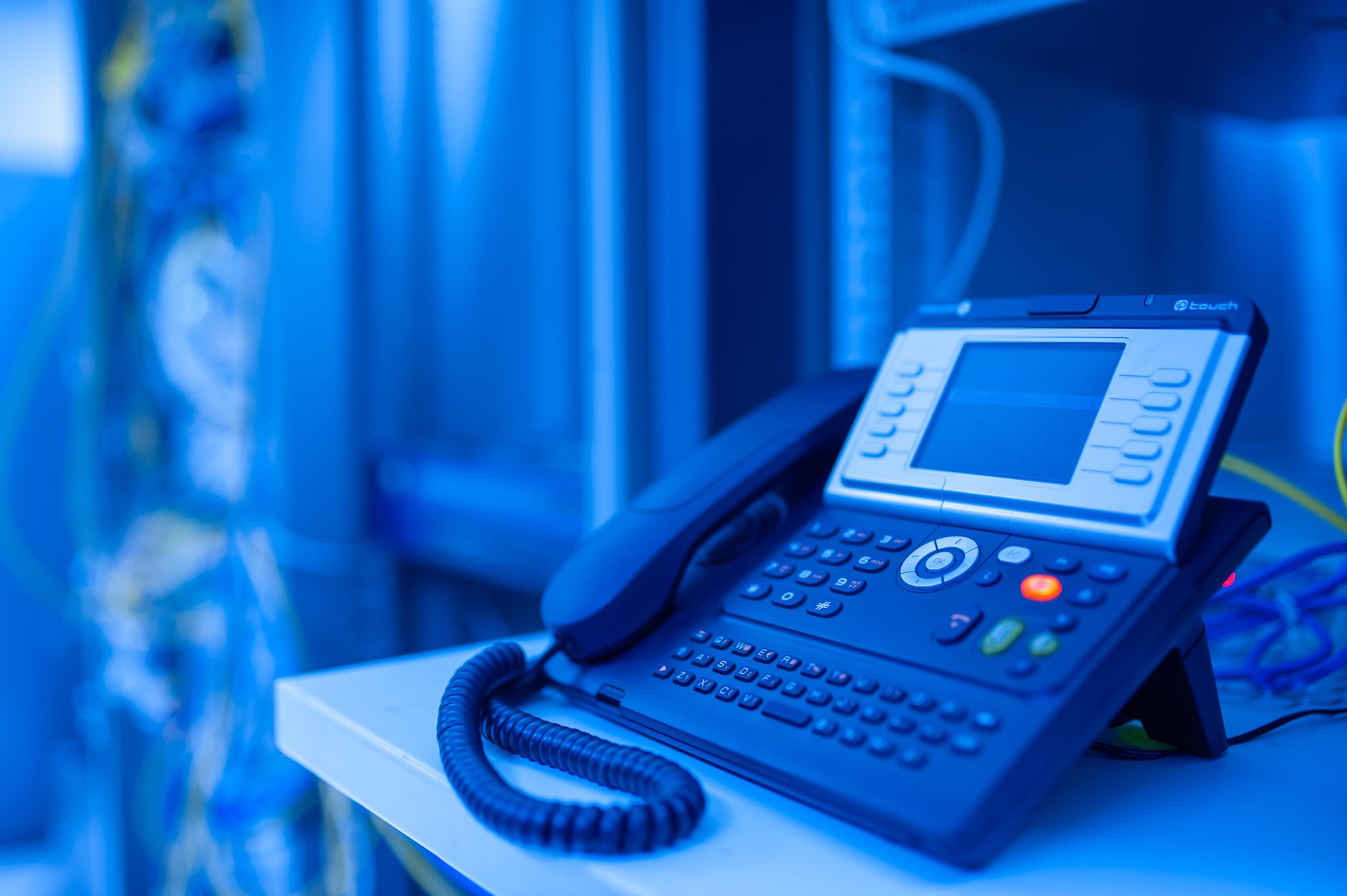 Cover illustration for VoIP for small business operations with cloud PBX, devices, and call flow icons
